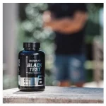 Black test 90 caps. on a table by BioTechUSA